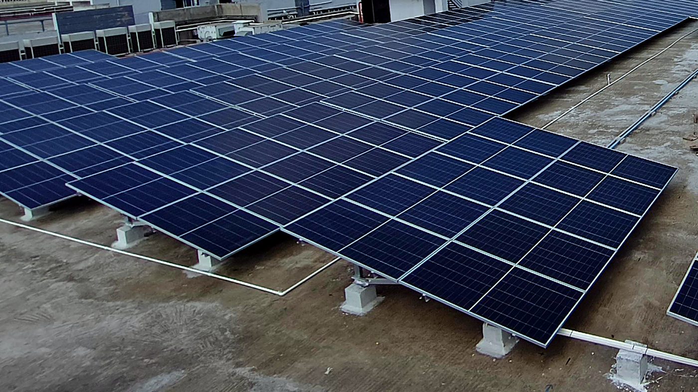 Close view of mounted solar panel rows on ballast structures